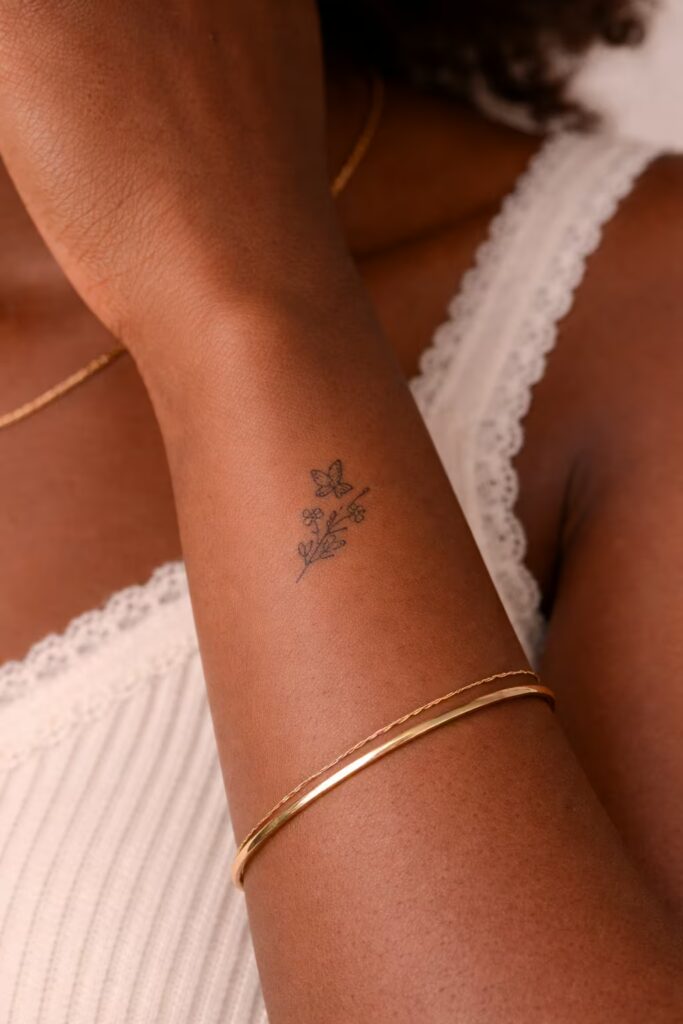 Elegant Butterfly and Floral Tattoo