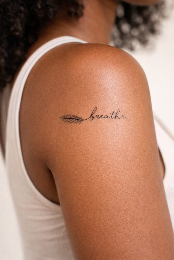 Feather Script “Breathe” Fine Line Tiny Tattoo