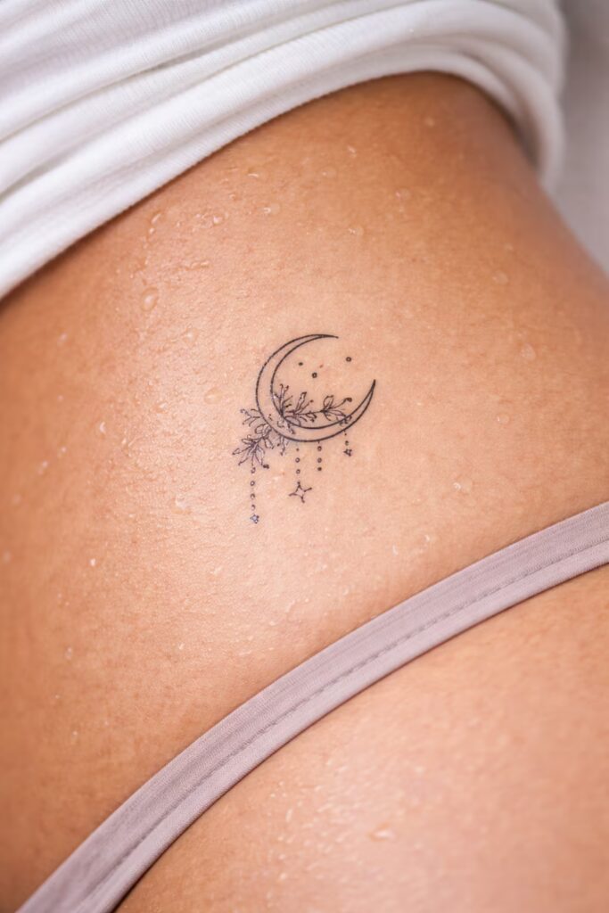 2. Lunar Blossom Beads Lower Hip Tattoo Ideas for Women