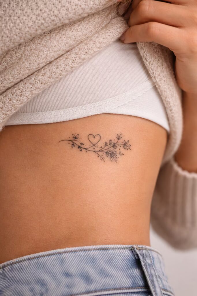 Side Ribcage Wildflower Love Symbol Tattoo