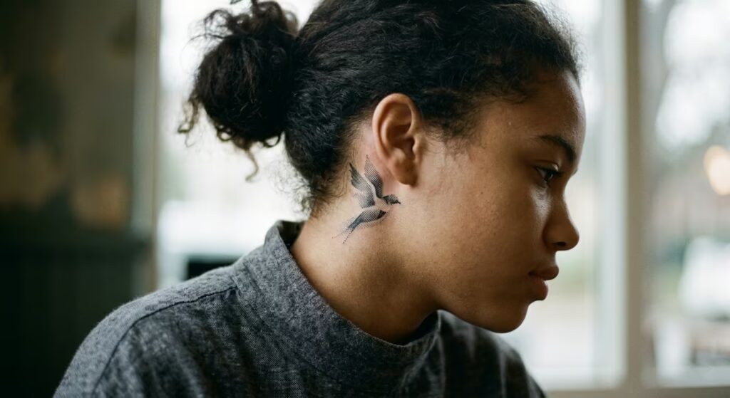  Risograph Bioluminescent Bird Behind-the-Ear Tattoo