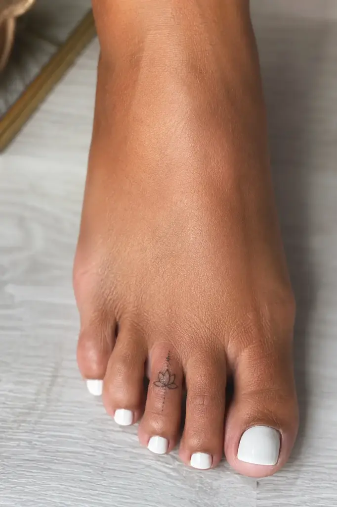 Lotus And Beads Toe Tattoo